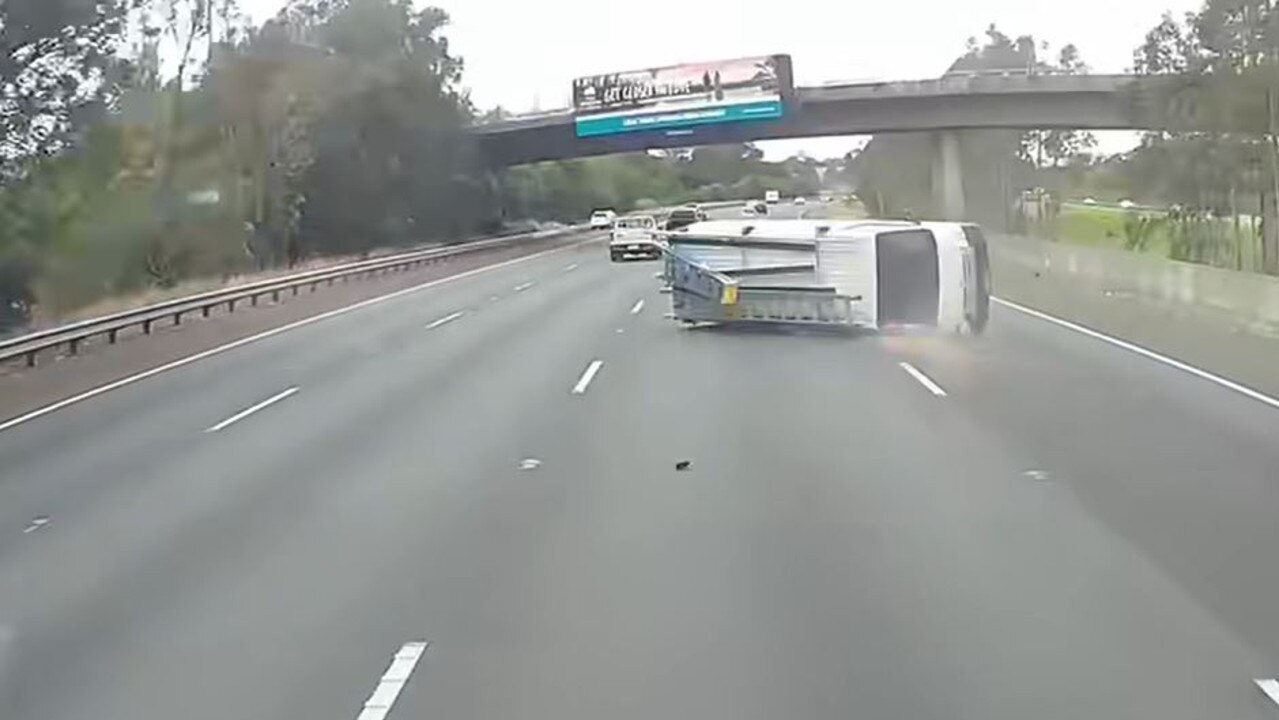 Dashcam footage captures the moment the van rolls on the Hume Highway. Picture: Dashcam Owners Australia