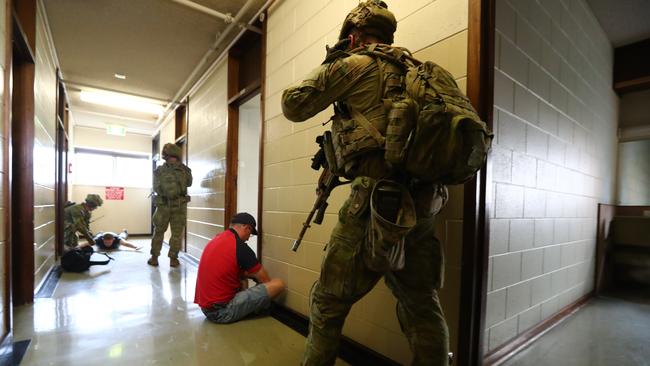 Soldiers guard civilians in the old RAH drill. Picture: Tait Schmaal