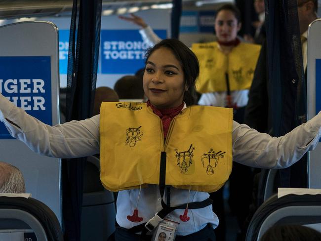 Flight crew demonstrate safety features on Democratic presidential nominee Hillary Clinton's plane. Picture: AFP