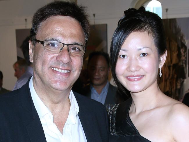 Michel and Coco Germani at the Billich Gallery Christmas Party at the Rocks  hosted by artist Charles Billich.