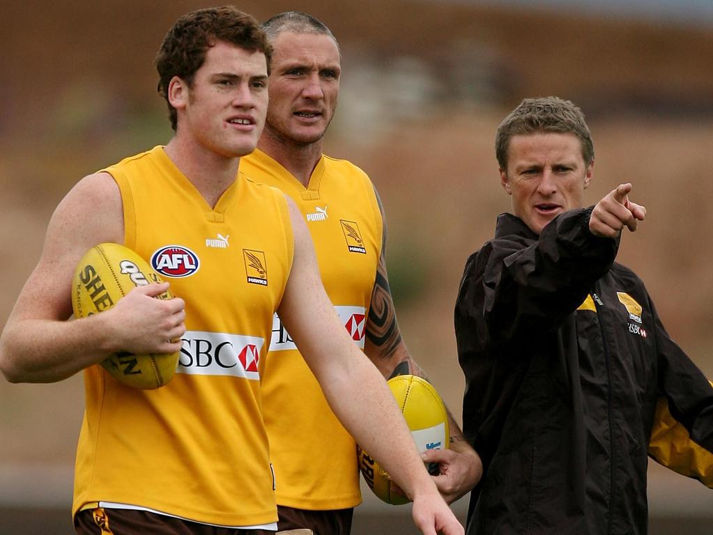 Jarryd Roughead and Peter Everitt get directions from Hardwick at Hawthorn training during his time as an assistant coach.