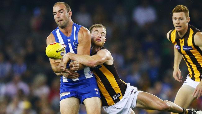 Tom Mitchell tackles Ben Cunnington.