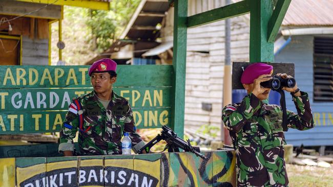 Indonesian solders from Marines are on their duty at a military post. Picture: Jiro Ose