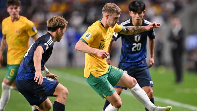 Australia's Riley McGree controls the ball during the FIFA World Cup 2026 Asian zone qualifiers football between Japan and Australia at Saitama Stadium in Saitama on October 15, 2024. (Photo by Philip FONG / AFP)