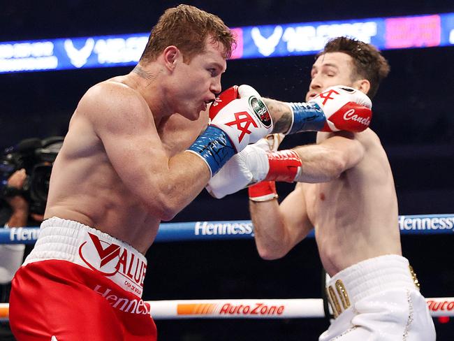 SAN ANTONIO, TEXAS - DECEMBER 19: In this handout image provided by Matchroom, Canelo Alvarez punches Callum Smith during their super middleweight title bout at the Alamodome on December 19, 2020 in San Antonio, Texas. (Photo by Ed Mulholland/Matchroom via Getty Images)