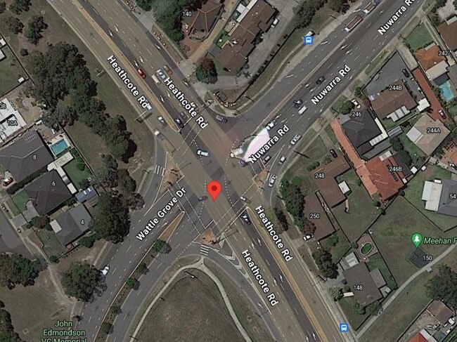 An elderly woman was trapped inside a car following two-car crash on Wattle Grove Drive and Nuwarra Rd.