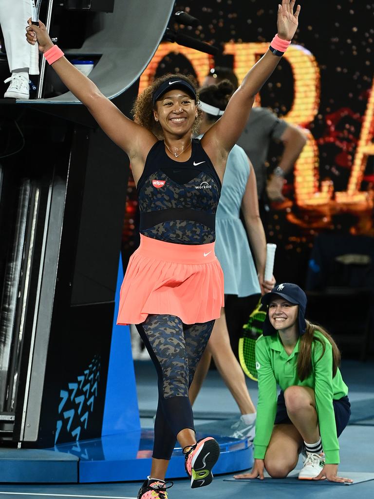 Osaka celebrates her win.