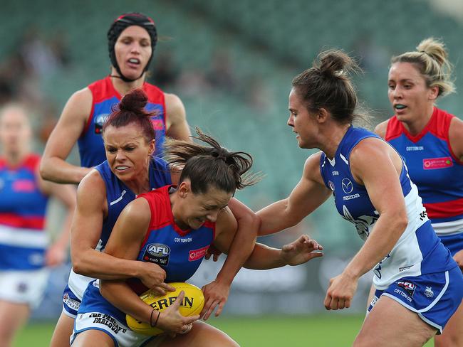 Bulldog Monique Conti feels the stifling pressure from the Roos. Picture: Getty Images