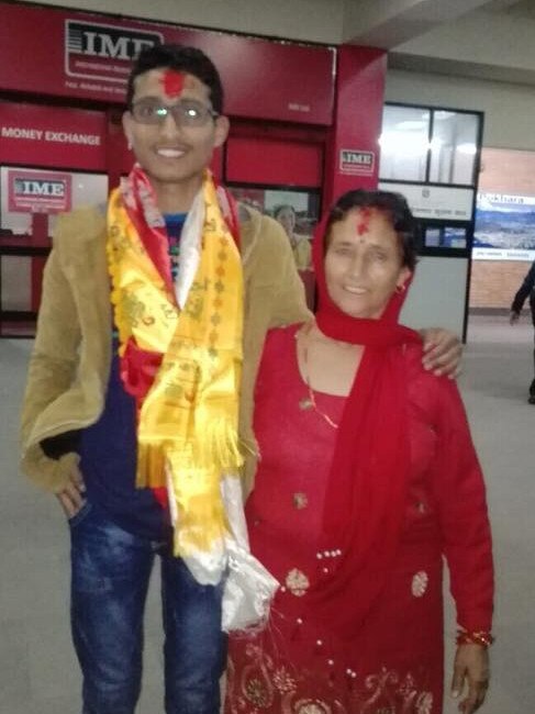 Nischal Ghimire with Mother at Katmandu airport leaving to Adelaide in 2016. Picture: Facebook 