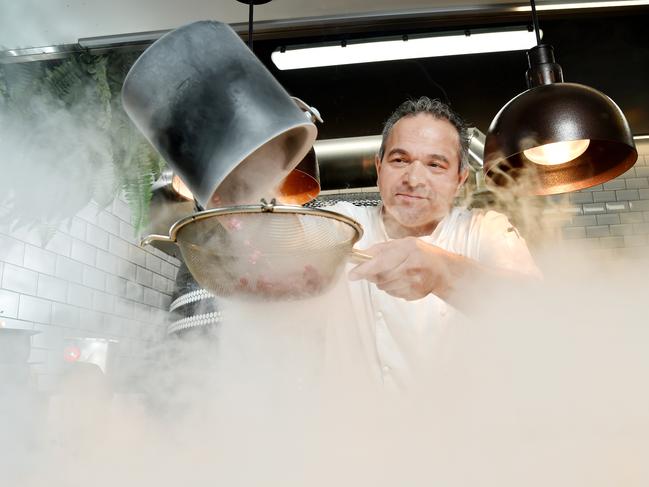 Chef Fabio De Lutiis freezes coulis in liquid nitrogen at Macquarie Park on Thursday October 4nd. Fabio De Lutiis, who runs the pizzeria at Macquarie University's UBar, has won silver in the Australian arm of the World Pizza Championships for his dessert pizza. (AAP IMAGE / Troy Snook)