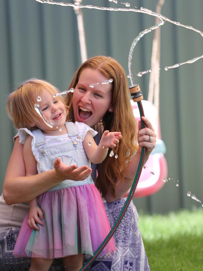 Desiree McGurgan, 26 with her daughter Mirelle, 2 in the backyard of their Roxby Downs home. Picture: Tait Schmaal