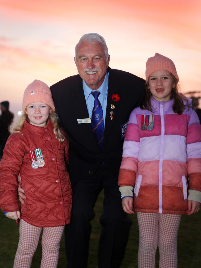 Shane Murphy with granddaughters Elke, 5 and Clementine Murphy, 7, at Geelong’s Anzac Day dawn service. Picture: Alison Wynd