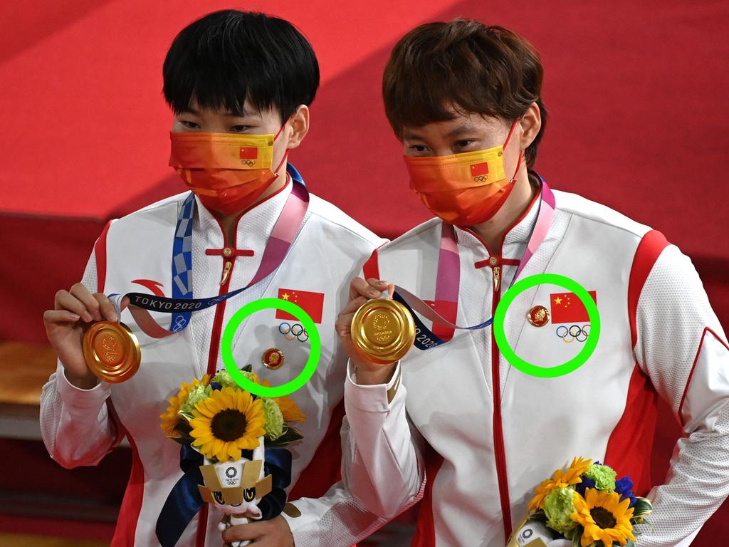 Gold medallists China's Bao Shanju (L) and China's Zhong Tianshi pose with their medals on the podium after the women's track cycling team sprint finals during the Tokyo 2020 Olympics. Picture: Greg Baker / AFP