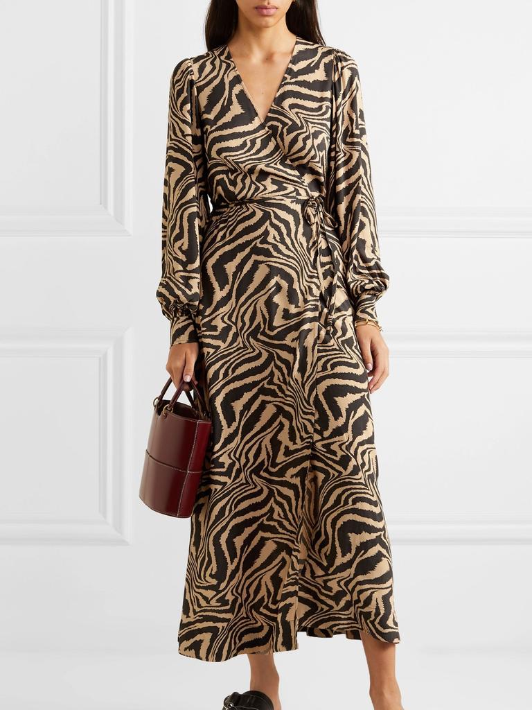 If you’re looking to make a designer splurge, Net-A-Porter’s highly anticipated mid-year sale is full of goodies. This ‘Tiger-Print Crepe Wrap Midi Dress’ by Ganni ha been reduced from $158.05 from $316.10. Picture: Net-a-Porter.