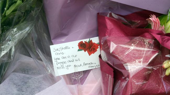 A tribute left at the makeshift memorial for the crash victims. Picture: Richard Gosling