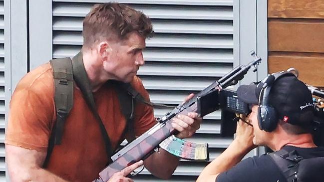 COURIER MAIL FEE APPLIES  EXCLUSIVE PICTURESLiam Hemsworth, Ricky Whittle and Milo Ventimiglia continue filming Land of Bad in the mountains behind the Gold Coast.Lots of Extras and a headless lady can also be seen.NOTE: The caption above is the photographerÃ¢â‚¬â„¢s impression only and may or may not be factual. It is the responsibility of the end user, publisher or licensee to verify the data before publication. All editorial images subject to the following: For editorial use only. Additional clearance required for commercial, wireless, internet or promotional use.Images may not be altered or modified. Matrix Media Group makes no representations or warranties regarding names, trademarks or logos appearing in the images.DISCLAIMER: To the maximum extent permitted by law, we make no representations or warranties about our Content, including (without limitation) that:They are complete, accurate, reliable, up-to-date and suitable for any particular purpose.