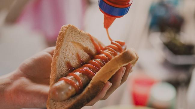 Close up shot of a sausage in a piece of bread, know as 'sausage sizzle' by the Australian community.  Picture: istock