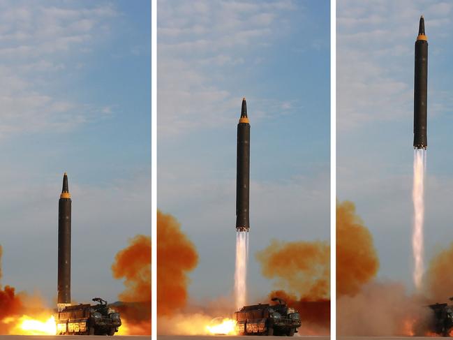 TOPSHOT - This undated combination picture released from North Korea's official Korean Central News Agency (KCNA) on September 16, 2017 shows a launching drill of the medium-and-long range strategic ballistic rocket Hwasong-12 at an undisclosed location. Kim vowed to complete North Korea's nuclear force despite sanctions, saying the final goal of his country's weapons development is "equilibrium of real force" with the United States, state media reported on September 16.  / AFP PHOTO / KCNA VIA KNS / STR /  - South Korea OUT / REPUBLIC OF KOREA OUT   ---EDITORS NOTE--- RESTRICTED TO EDITORIAL USE - MANDATORY CREDIT "AFP PHOTO/KCNA VIA KNS" - NO MARKETING NO ADVERTISING CAMPAIGNS - DISTRIBUTED AS A SERVICE TO CLIENTS THIS PICTURE WAS MADE AVAILABLE BY A THIRD PARTY. AFP CAN NOT INDEPENDENTLY VERIFY THE AUTHENTICITY, LOCATION, DATE AND CONTENT OF THIS IMAGE. THIS PHOTO IS DISTRIBUTED EXACTLY AS RECEIVED BY AFP.  /