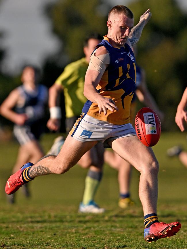 WRFL: Sunshine’s Jordan Davis gets a kick. Picture: Andy Brownbill