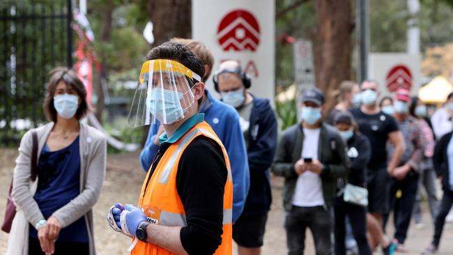 People queue at the Sydney Olympic Park vaccination hub. Picture: Damian Shaw