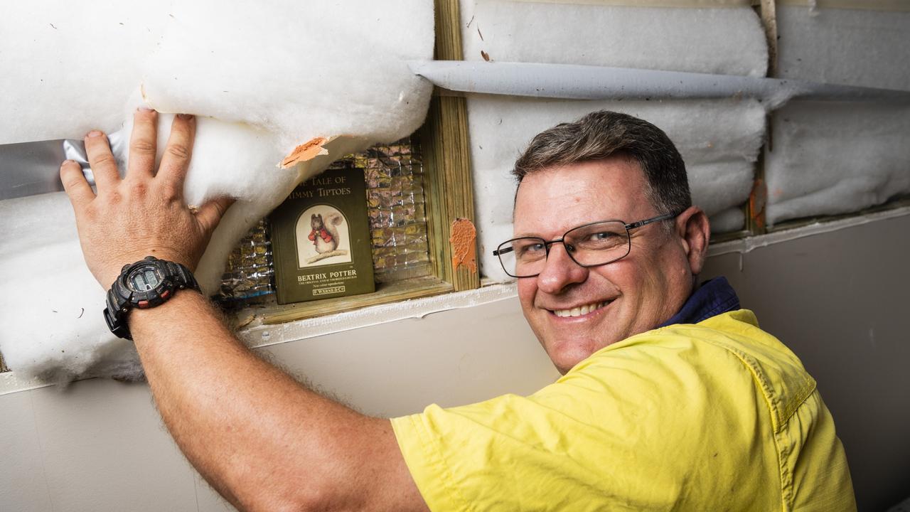 Andrew Fletcher found a Beatrix Potter book with a message written in it in a wall while renovating his Toowoomba home. Picture: Kevin Farmer