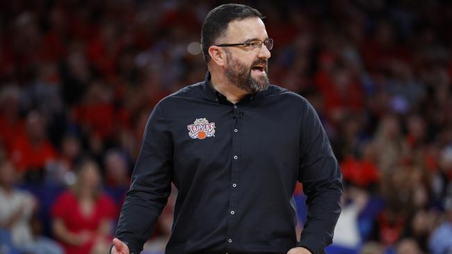 PERTH, AUSTRALIA - JANUARY 25: Adam Forde Head Coach of the Taipans talks to his players during the round 18 NBL match between Perth Wildcats and Cairns Taipans at RAC Arena, on January 25, 2025, in Perth, Australia. (Photo by James Worsfold/Getty Images)