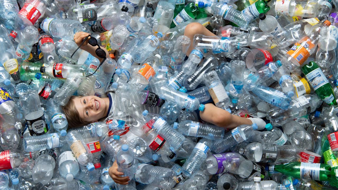 Harry Robinson and his father Nik have a Kickstarter campaign to turn used soft drink bottles into 100 per cent recycled sunglasses. Picture: Monique Harmer/AAP