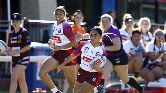 Action from the under-19s women's NRL championships game between Queensland Rubys and South Australia in Miami. Picture: Tertius Pickard