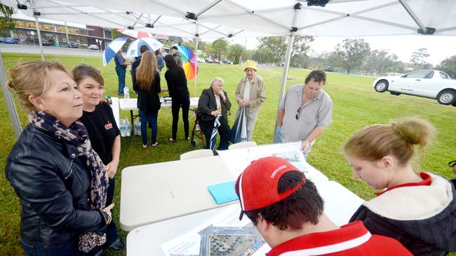 Mayor Denise Knight with local skaters Jay O'Connell and Sami Taylor view the plans for the skate park at Breslford Park back in 2013. Photo: Leigh Jensen / The Coffs Coast Advocate