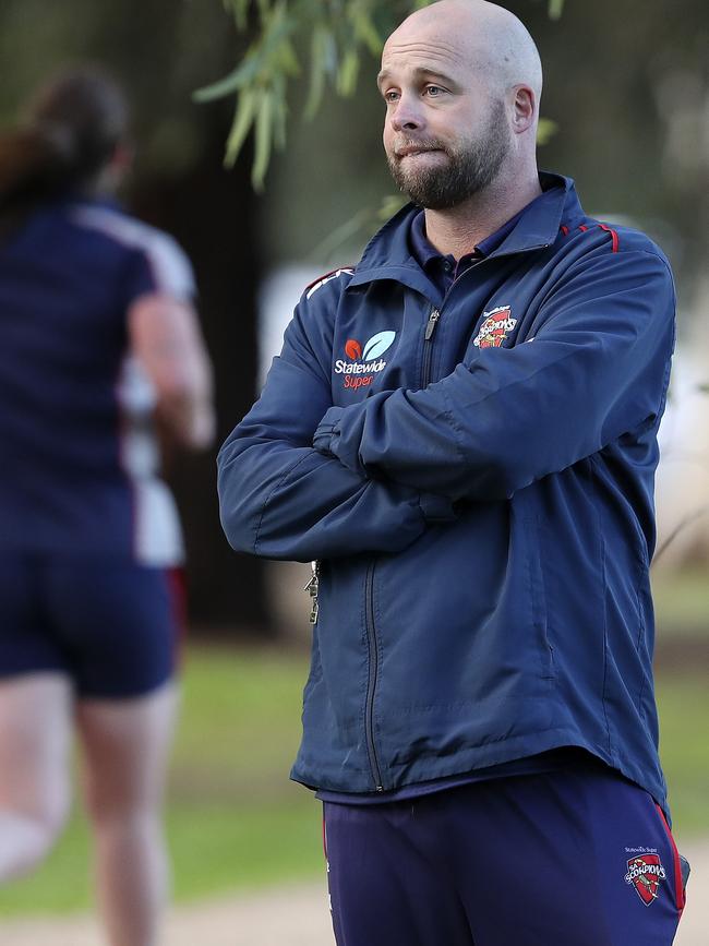 Luke Williams looks on as his players start a 2km time trial around the Adelaide parklands this week. Picture SARAH REED