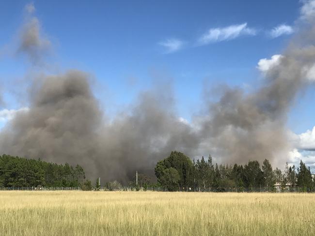 Gone: Munmorah Power Station boilers and coal hopper complex as dust rises after demolition.