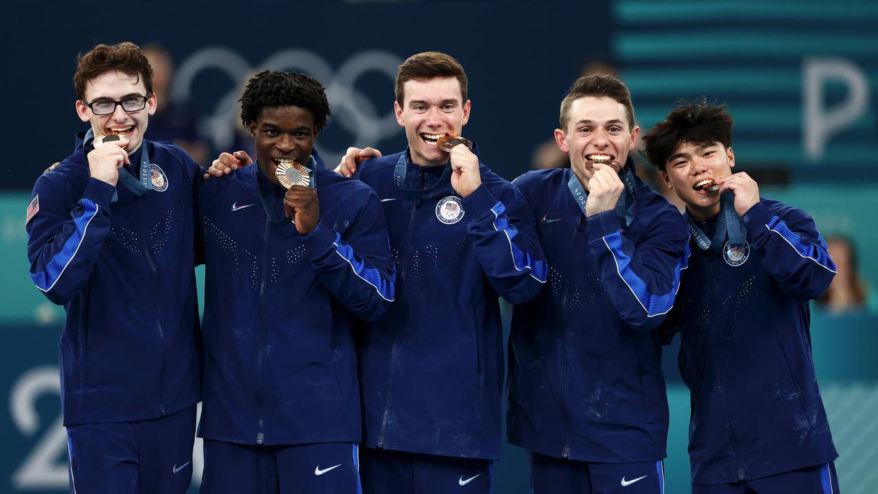 Stephen Nedoroscik (left) celebrates with his teammates. (Photo by Naomi Baker/Getty Images)