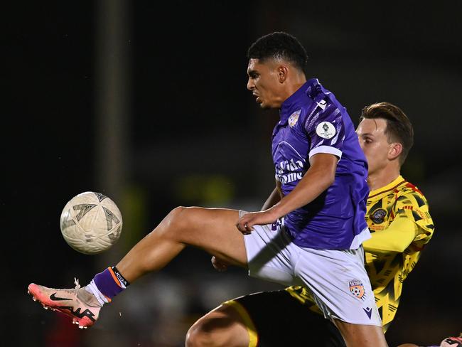 BRISBANE, AUSTRALIA - AUGUST 28: Abdelelah Faisal of Perth and Lachlan Sayers of Moreton City compete for the ball during the 2024 Australia Cup Round of 16 match between Moreton City Excelsior FC and Perth Glory FC at Perry Park on August 28, 2024 in Brisbane, Australia. (Photo by Albert Perez/Getty Images)