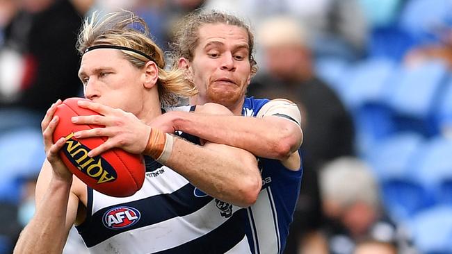 Mark Blicavs is tackled by Jed Anderson at Blundstone Arena. Picture: AFL Photos/via Getty Images