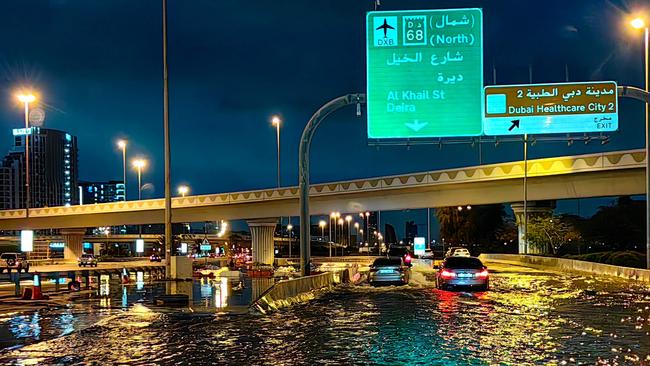 A flooded road to the airport. (Photo by Giuseppe CACACE / AFP)