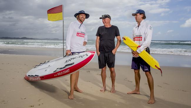 Michael Green speaks to his rescuers, council lifeguards Jens Spencer and Stacey Galbraith. Picture: Jerad Williams