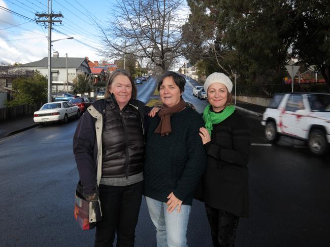 West Hobart residents, from left, Di Elliffe, Helayne Short and Amanda Staley have been the driving force behind getting the speed limit reduced near Caldew Park. Picture: LUKE BOWDEN