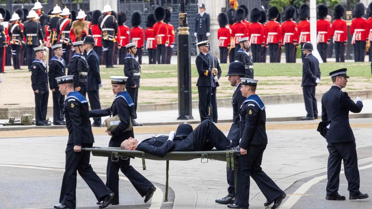 Police officer collapses, carried away on stretcher during Queen’s ...