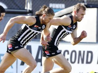 SANFL - Port Adelaide v Glenelg at Alberton oval. Aaron Young and Jack Hombsch warming up for the Magpies. Picture Sarah Reed