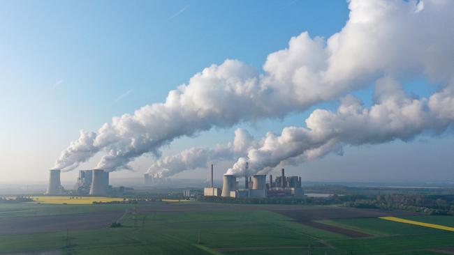 Steam rises from cooling towers at the Neurath, left and right, and Niederaussem, centre, coal-fired power plants at Neurath, Germany. Picture: Getty Images