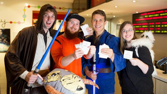 Fans dressed as Star Wars characters clutch their tickets for opening day sessions of Rogue One after advance ticket sales were launched with a "mannequin challenge" at Event Cinemas George St in Sydney on Monday. Picture: Supplied