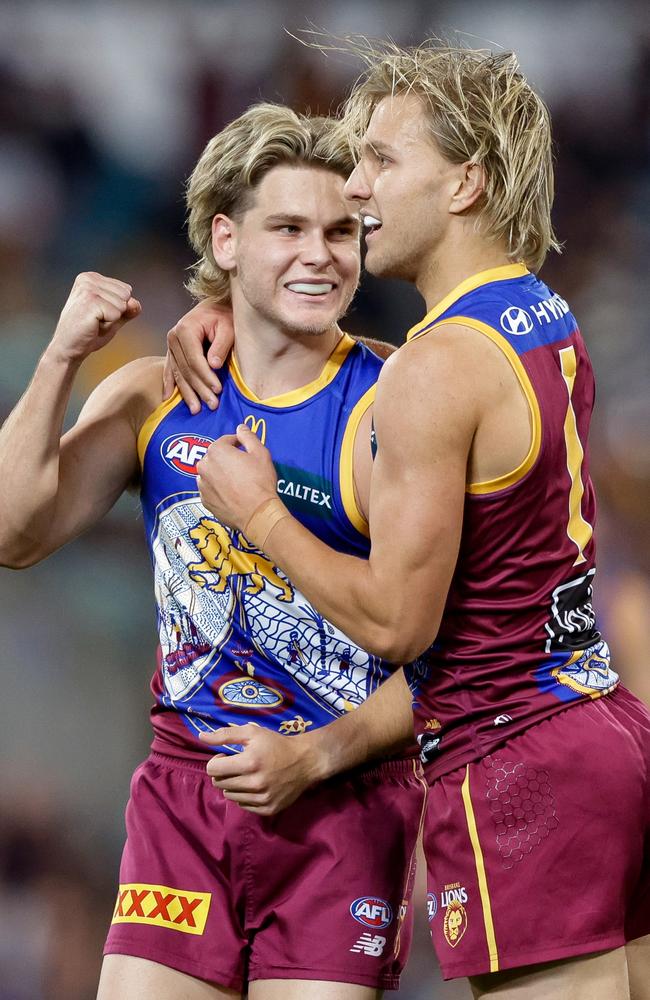 Will Ashcroft and Kai Lohmann celebrate after a Lions goal. Picture: Russell Freeman/AFL Photos via Getty Images.