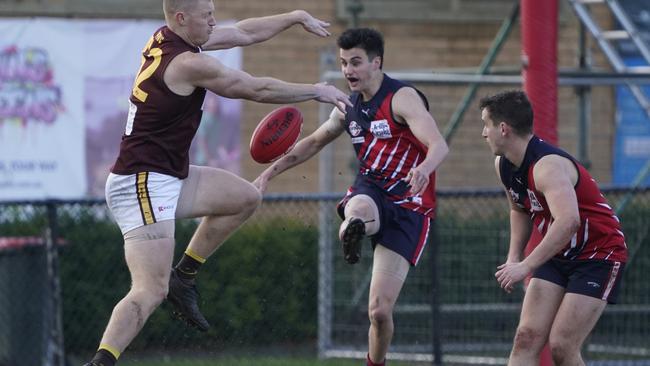 Mitch Frescher takes a kick under pressure on Saturday. Picture: Valeriu Campan