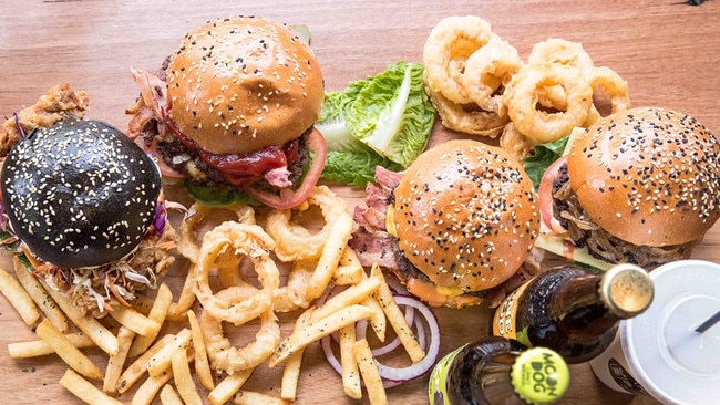 The Melbourne-based eatery is known for its American-style burgers — particularly the black, squid ink bun (left).