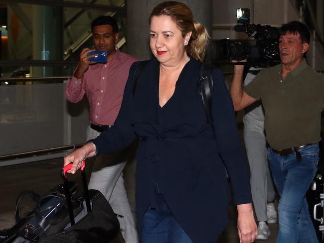 Premier Annastacia Palaszczuk arrives at Brisbane Airport late on Sunday night. Picture: David Clark