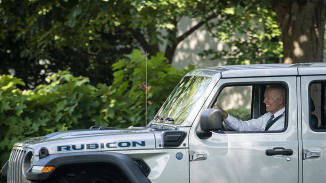 Joe Biden drives an electric Jeep Wrangler on the South Lawn of the White House in 2021. Picture: Getty Images