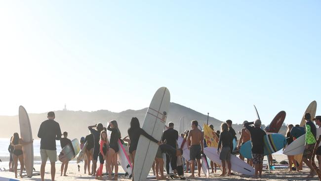 Members of the public took part in a paddle-out at Byron Bay's Main Beach to protest against the planned Netflix reality show Byron Baes on the morning of Tuesday, April 20, 2021. Picture: Liana Boss