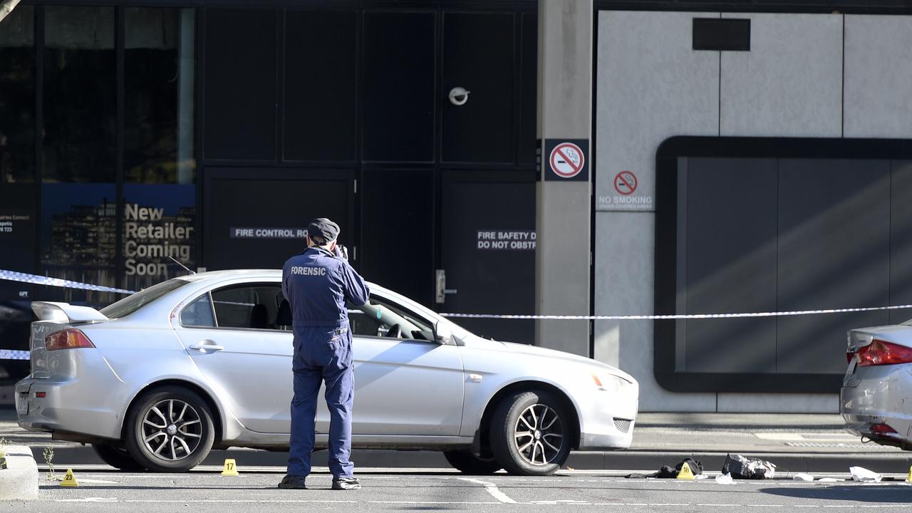 Forensic police examine one of two silver cars believed to be involved in an incident at Melbourne’s Docklands. Picture: NCA NewsWire / Andrew Henshaw