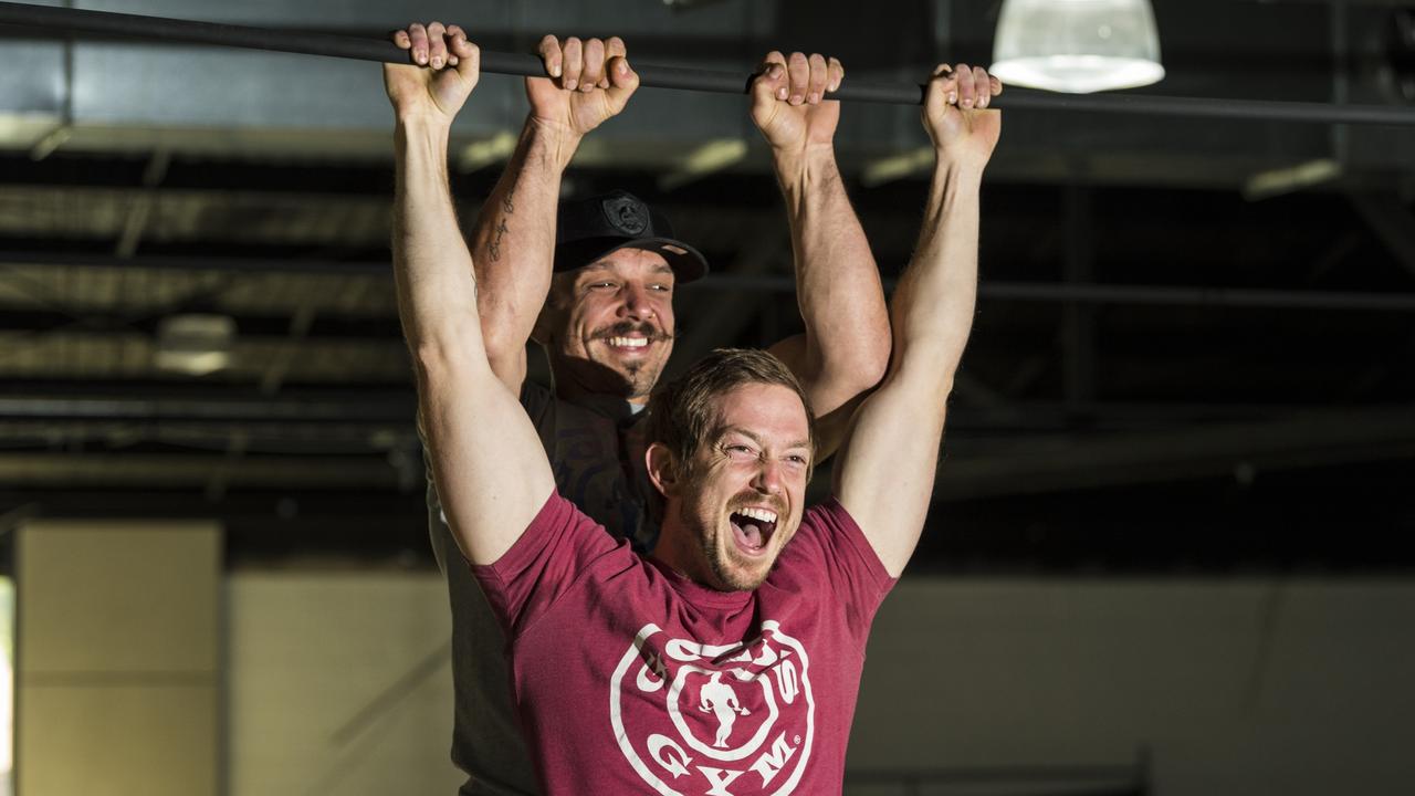 Gold's Gym Toowoomba franchise owners Joe Sobara (left) and Bevin Jones do pull-ups on a beam in the former Aldi Clifford Gardens that they converted into a Gold's Gym. Picture: Kevin Farmer