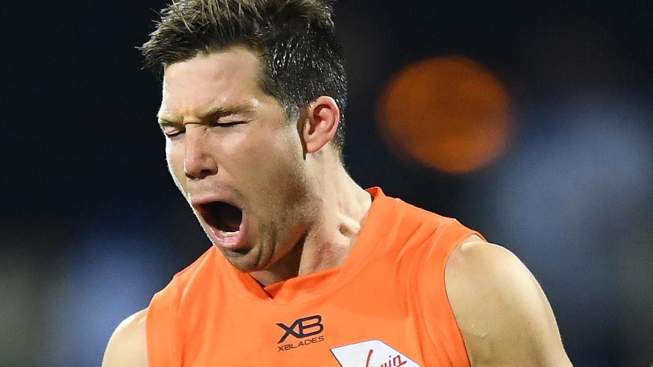 Toby Greene of the Giants celebrates kicking a goal.